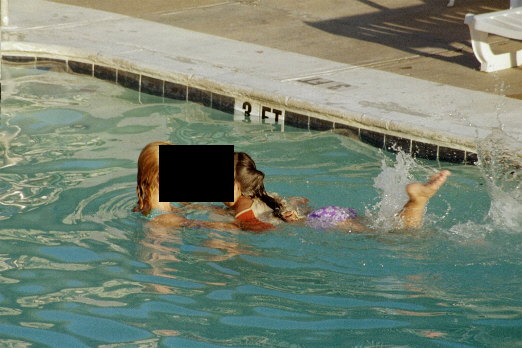 Kicking in the water with a little help.